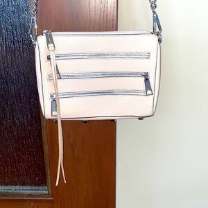 Rebecca Minkoff crossbody bag in a pale pink. Great summer bag! Zipper detail!